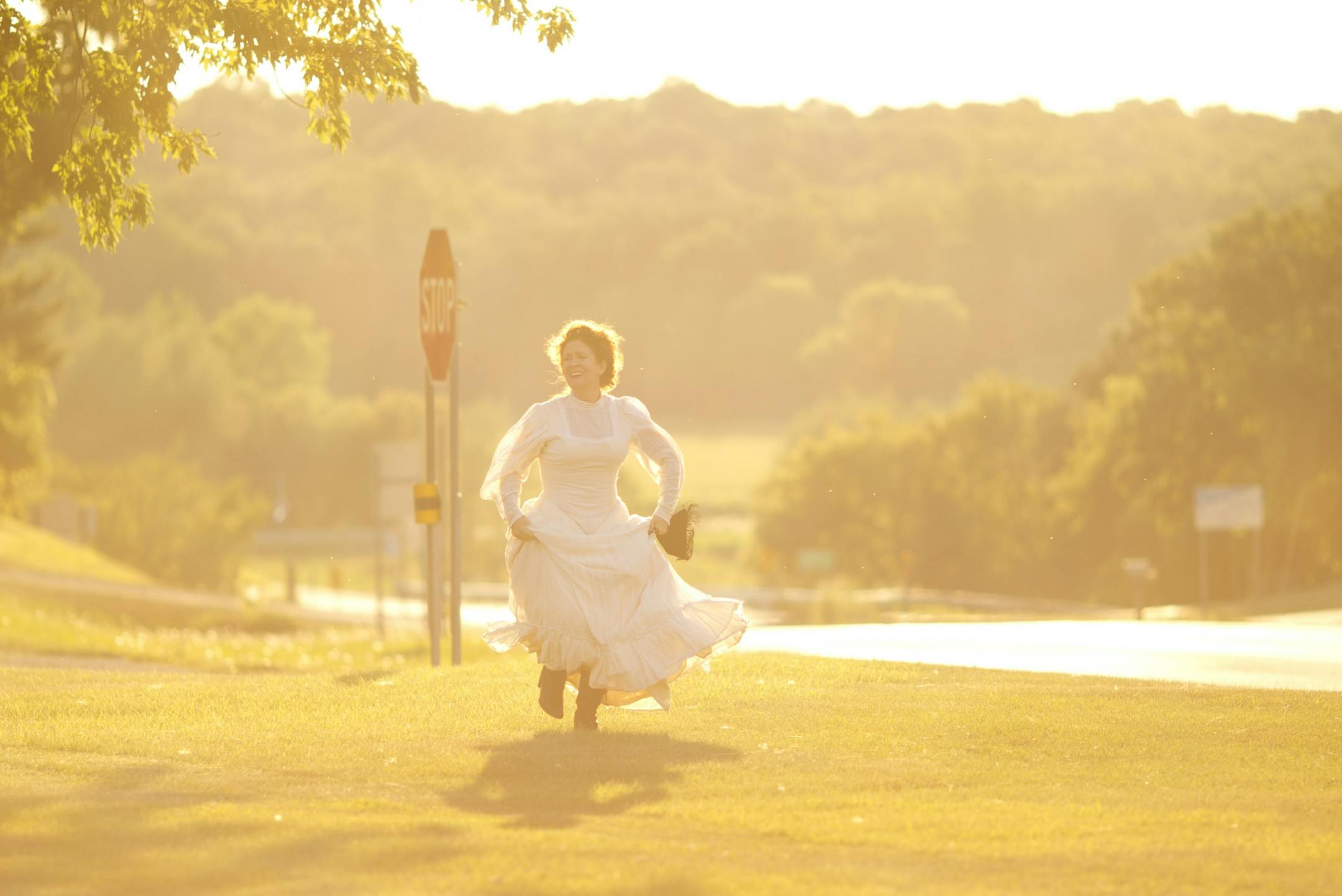 Luverne Seifert and Darcey Engen, are theater artists who are using a Legacy Grant to tour their production of "The Cherry Orchard" to five small towns in Minnesota over the next five weeks. The first production is in Kenyon. The site-specific production was staged inside and outside the historic M.T. Gunderson House in Kenyon, Minn. Wednesday night, July 11, 2012. "The Cherry Orchard" begins with the arrival on the scene of the owner of the estate, Liubov Ranyevskaya, played by Darcey Engen.