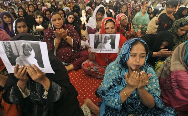 Supporters of Pakistani political party Muttahida Qaumi Movement (MQM), chant prayers in support of 14-year-old schoolgirl Malala Yousufzai, who was s