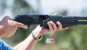 In this photo taken April 7, 2016, Jonathan Mossberg, whose iGun Technology Corp. is working to develop a "smart gun," demonstrates the firearm, in Da