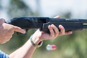 In this photo taken April 7, 2016, Jonathan Mossberg, whose iGun Technology Corp. is working to develop a "smart gun," demonstrates the firearm, in Da