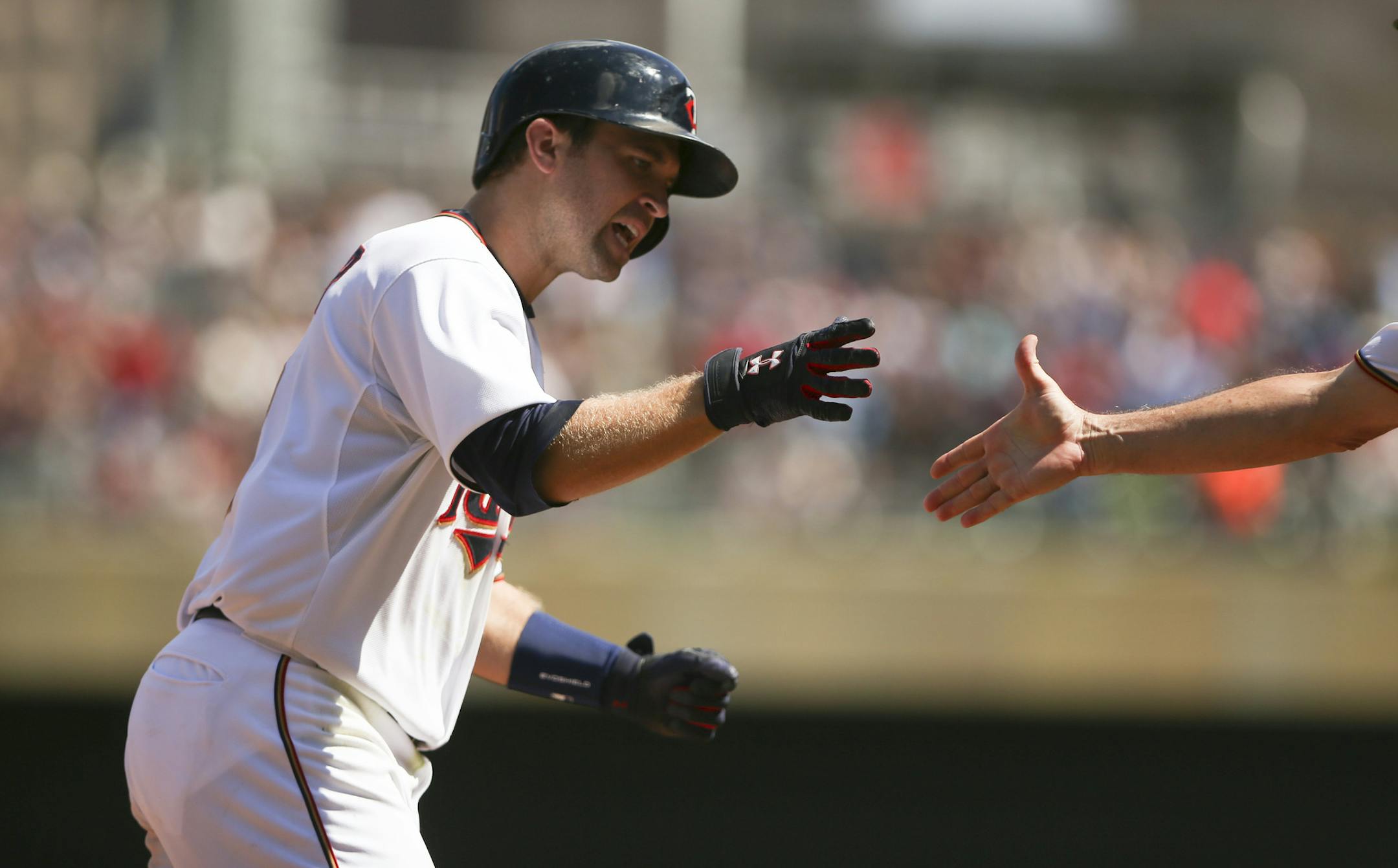 Minnesota Twins second baseman Brian Dozier was congratulated by third base coach Gene Glynn after he hit a game tying home run in the bottom of the ninth inning off Seattle starting pitcher Hisashi Iwakuma Sunday afternoon at Target Field. ] JEFF WHEELER ï jeff.wheeler@startribune.com The Twins lost 4-1 to the Seattle Mariners in 11 innings Sunday afternoon, August 2, 2015 at Target Field in Minneapolis.