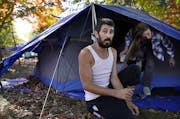 Brandon Harrison, 35, celebrated his birthday at a homeless encampment in Logan Park with his girlfriend Nichol Wyandt , 43, Wednesday in Minneapolis.