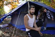 Brandon Harrison, 35, celebrated his birthday at a homeless encampment in Logan Park with his girlfriend Nichol Wyandt , 43, Wednesday in Minneapolis.