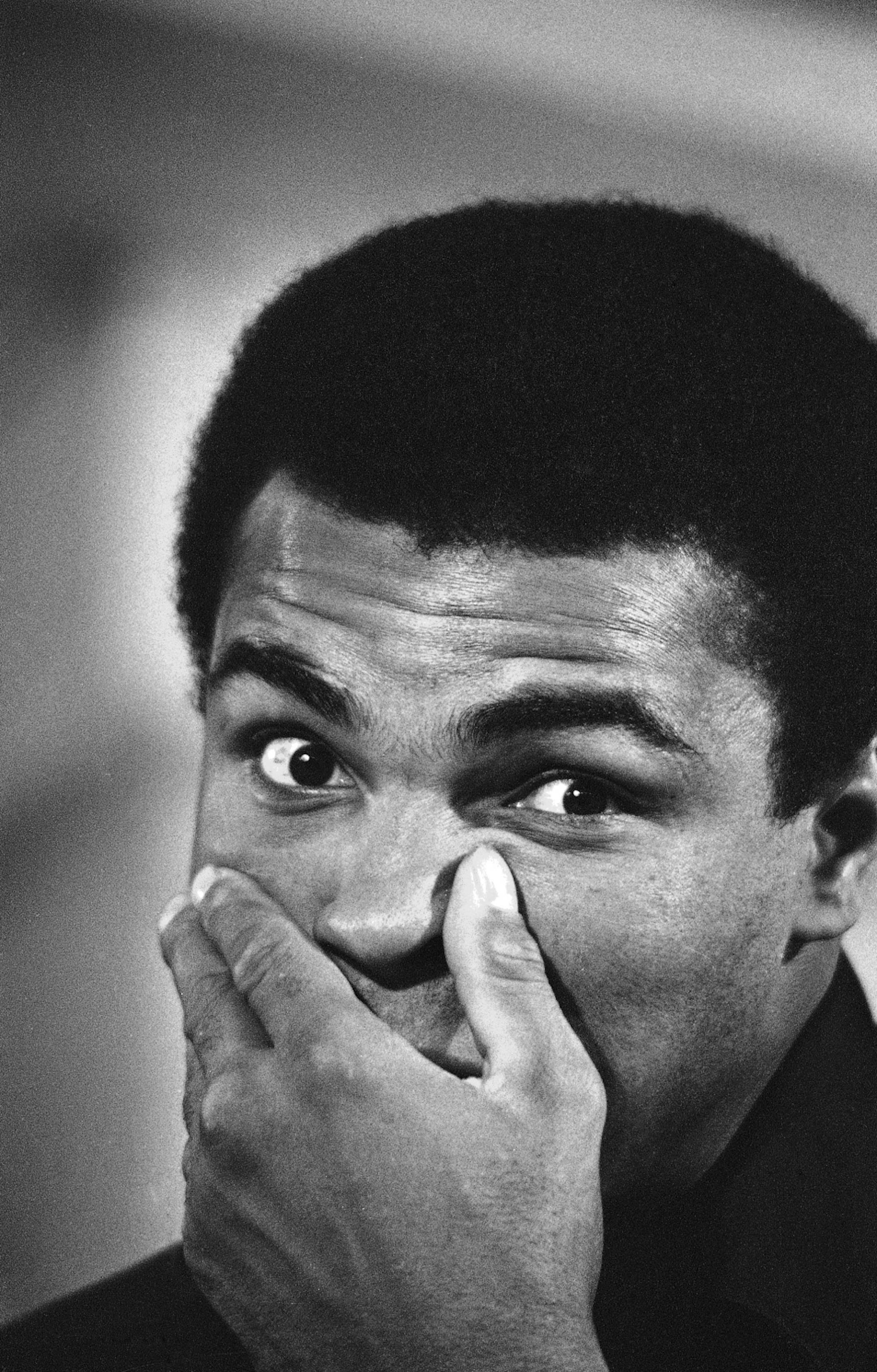 Muhammad Ali gives a quizzical stare as he ponders the question of what he will do with his $2.5 million dollar share of the March 8 fight with Joe Frazier, March 5, 1971. Ali spent some time with the press after his regularly scheduled workout in Miami Beach, Fla., answering questions relative to the upcoming bout. (AP Photo/Mark Foley) ORG XMIT: APHS283989