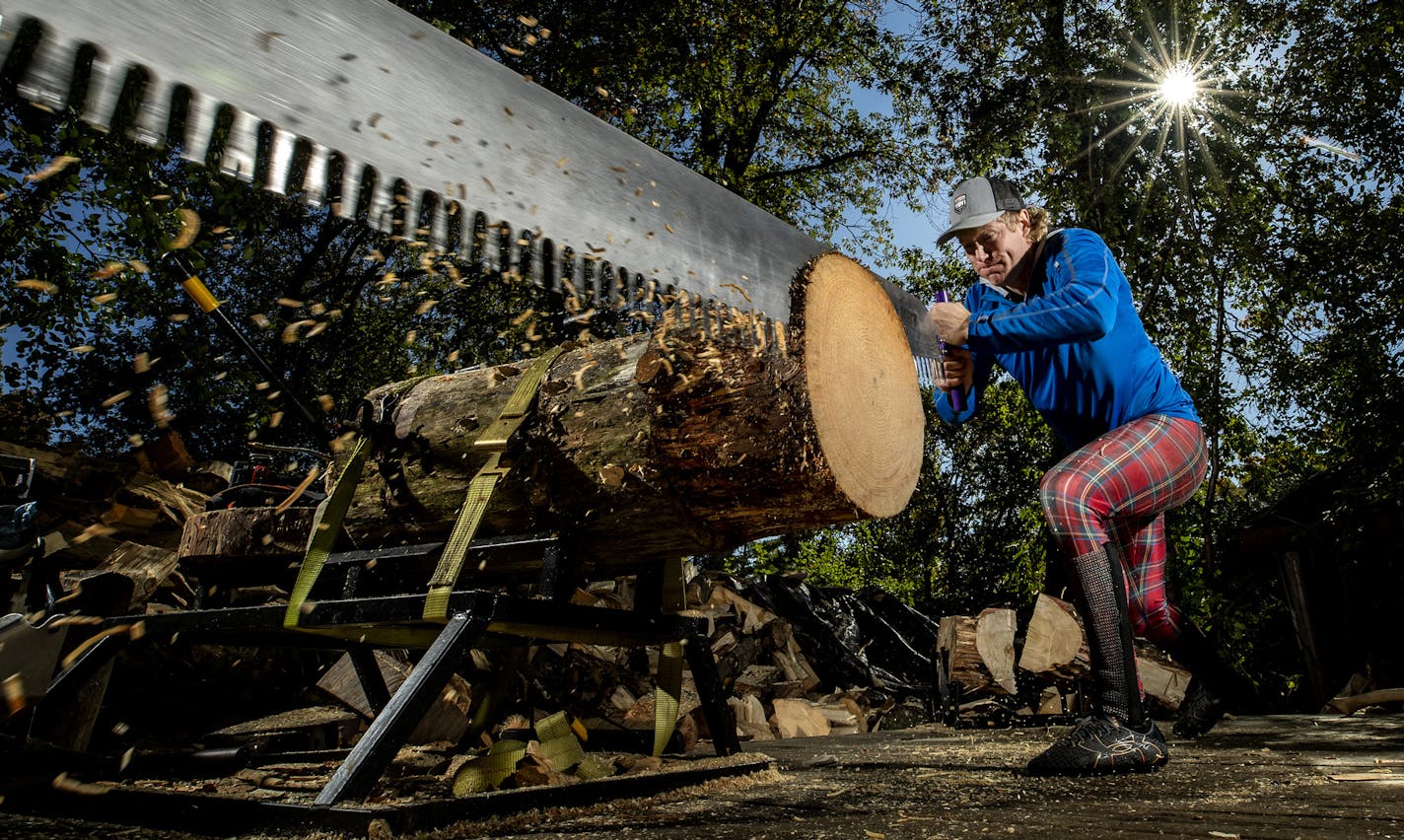 Cassidy Scheer practiced with the single buck saw at his home in Golden Valley. ] CARLOS GONZALEZ &#x2022; cgonzalez@startribune.com &#x2013; Golden Valley, MN &#x2013; October 17, 2019, One of best in the world, Cassidy Scheer of the legendary lumberjacking Scheer family, trains in his backyard in Golden Valley