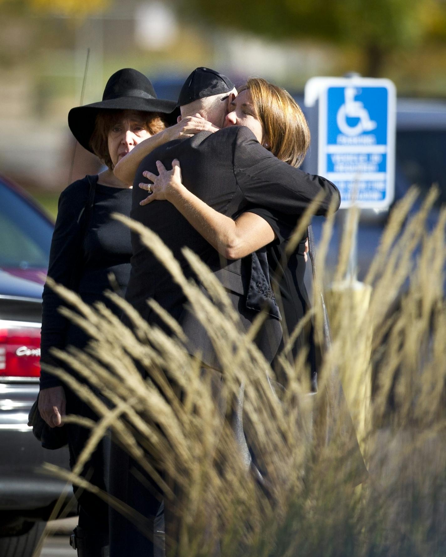 Shereen Rahamim hugged many loved ones as she arrived at the funeral for her husband Reuven Rahamim, who died in a workplace shooting last week, at Beth El Synagogue in St. Louis Park, Minn., on Sunday, September 30, 2012.