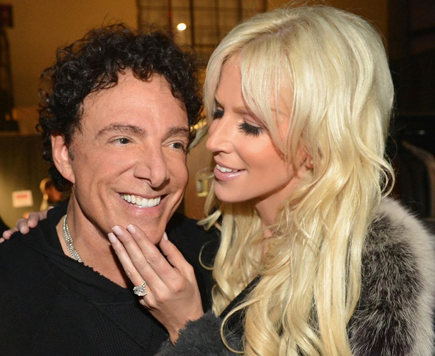 Journey's Neal Schon and Michaele Salahi get apology from the Daily Mail for false report. (PRNewsFoto/Neal Schon and Michaele Salahi, Rick Diamond) ORG XMIT: MIN2013040816454192