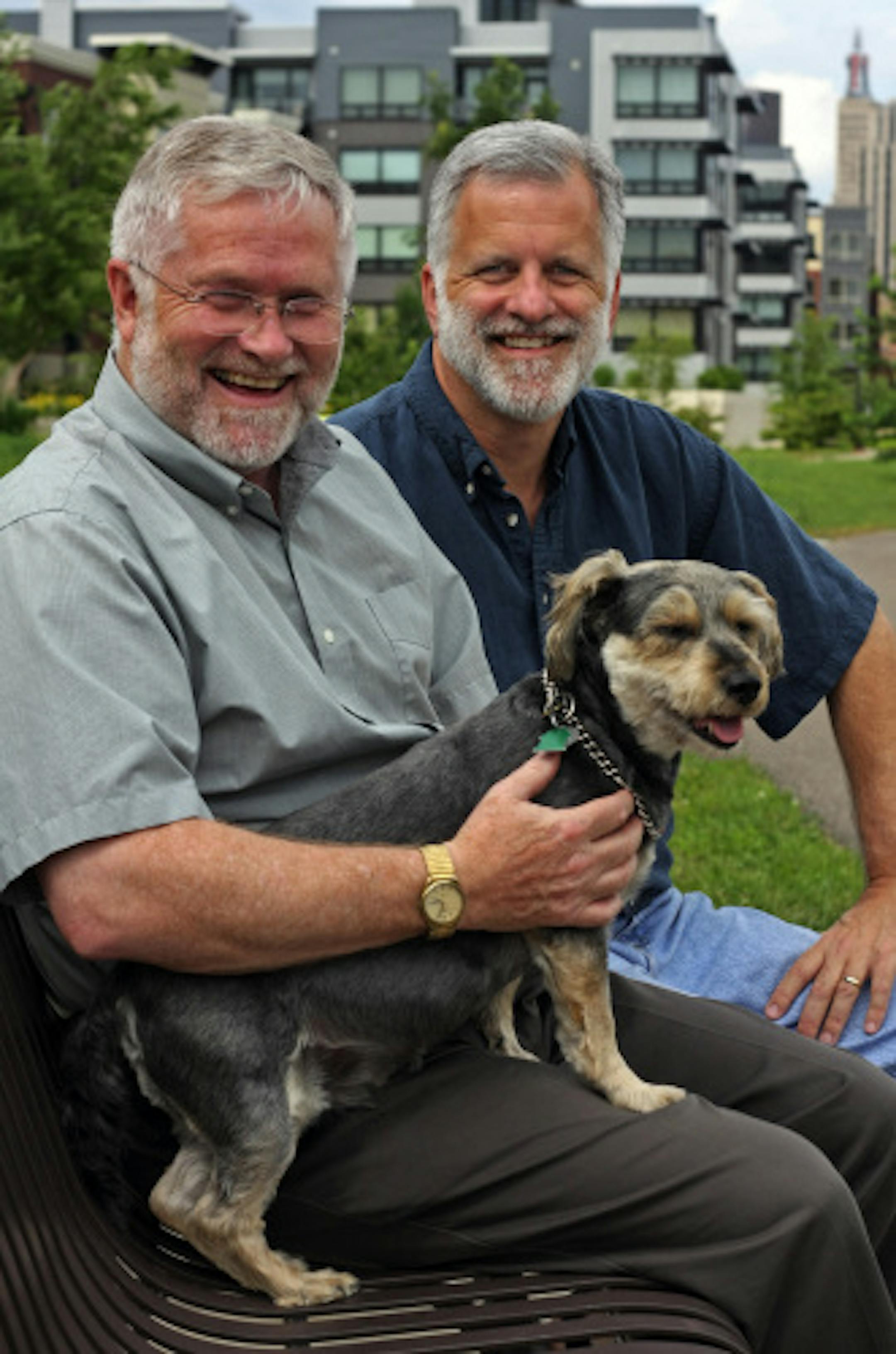 Don Yager ( left) and Rick Groger (and dog 'Bailey") along the path in front of their downtown St Paul townhouse. they were married 5 years ago in Thunder Bay when Canada made same-sex marriage legal.