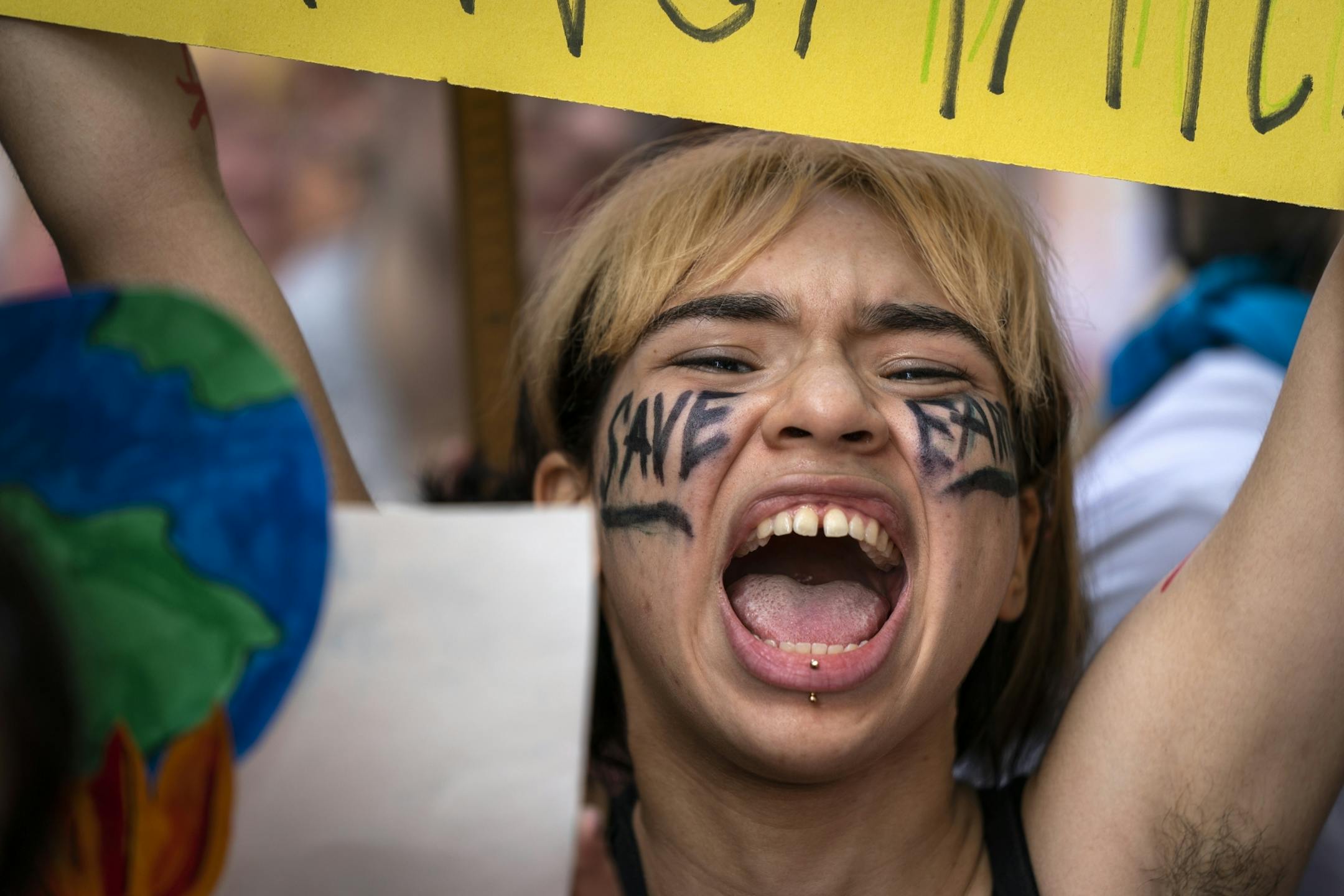 Kat Barsten, 17, of St. Paul chanted at Western Sculpture Park before the march to the Capitol.
