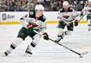 Wild left wing Liam Ohgren (28) skates with the puck against the Golden Knights during the first period Friday in Las Vegas.