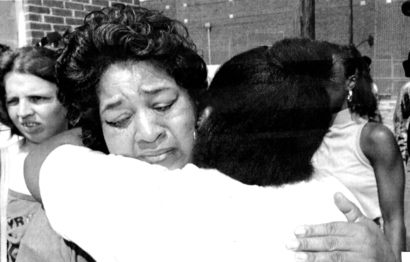 September 4, 1991 Comforting Hug - Manzelle Henderson, facing earner, a worker at Imperial Food Products in Hamlet. N.C., gets a comforting hug from a friend outside the plant Wednesday, after she arrived to pick up her pay check. Twenty five workers died end 49 were injured during a fire at the plant on Tuesday. September 5, 1991 September 11, 1991 Chuck Burton, AP Laserphoto