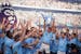 Manchester City's Matheus Nunes celebrates with the Premier League trophy after Sunday's victory over West Ham United.