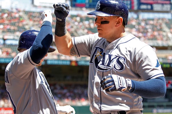 The Rays' Logan Morrison, right, celebrated with Corey Dickerson after his second-inning home run against the Twins on Sunday.