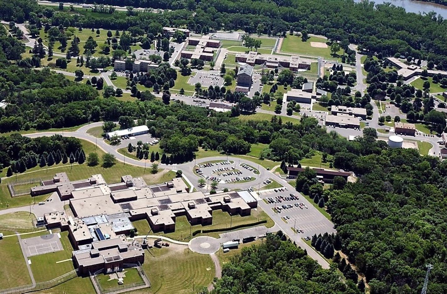 In this May, 2008 aerial photo, the Minnesota Security Hospital complex, lower left, is shown in St. Peter, Minn. Minnesota Gov. Mark Dayton and the human services commissioner met with staff members Wednesday, Feb. 8, 2012 in St. Peter following the resignations of six experienced psychiatrists who left in recent months over the management style of the facility's new administrator.