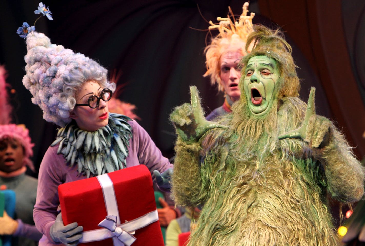 The Grinch (Reed Sigmund) falters in his attempt to say the word "love" in "Dr. Seuss' How The Grinch Stole Christmas" at The Children&#x201a;&#xc4;&#xf4;s Theatre Company in Minneapolis November 4, 2012. (Courtney Perry/Special to the Star Tribune) ORG XMIT: MIN1211051605137113