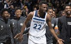 Minnesota Timberwolves Andrew Wiggins (22) was greeted by teammates on the court after making his third three pointer late in the fourth quarter.