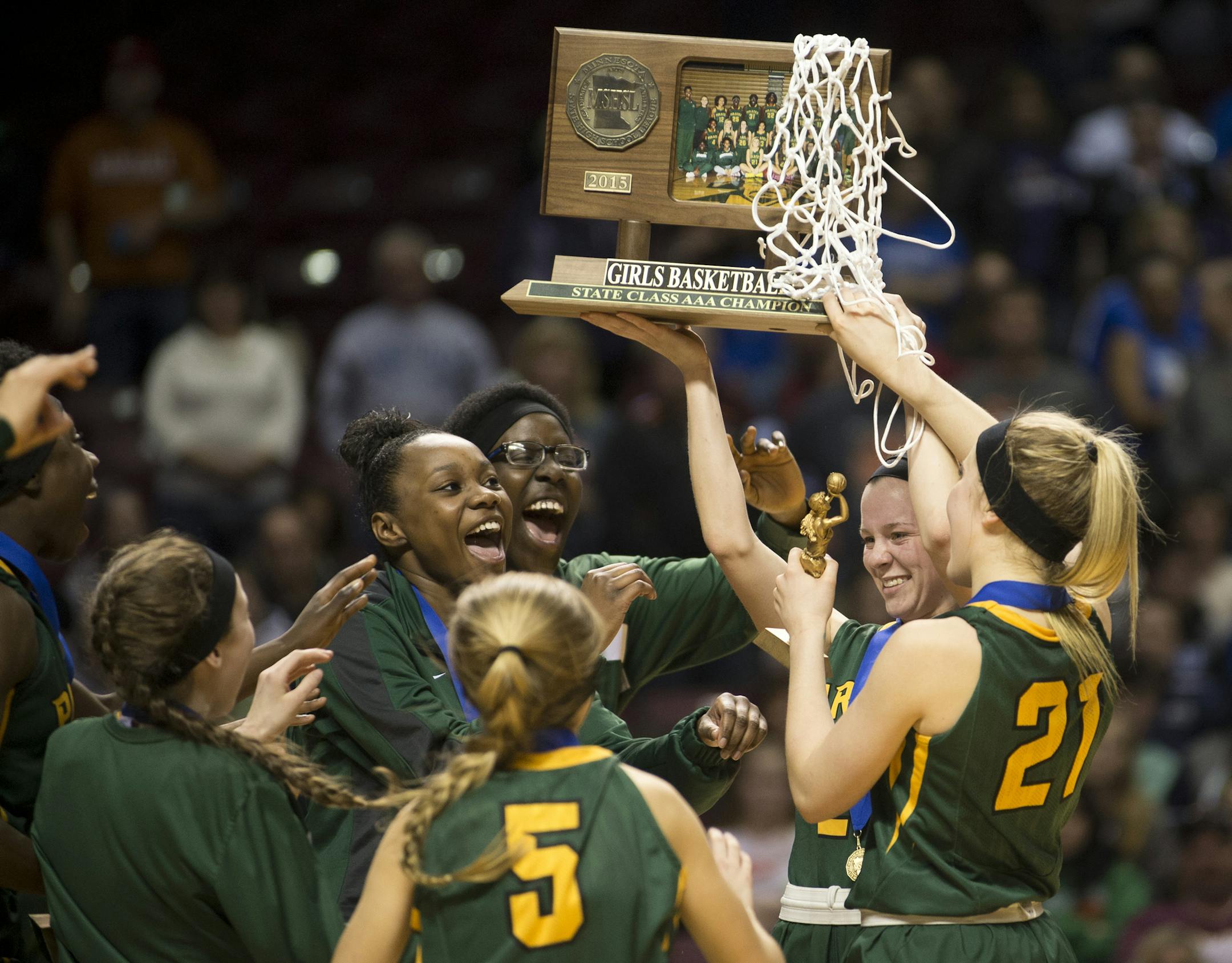 Park Center players celebrate with their championship trophy after defeating Marshall 52-45 in the Class 3A girls' basketball championship game on Saturday night. ] (Aaron Lavinsky | StarTribune) Marshall plays Park Center in the Class 3A girls' basketball championship game on Saturday, March 21, 2015 at Williams Arena. Park Center beat Marshall 52-45.