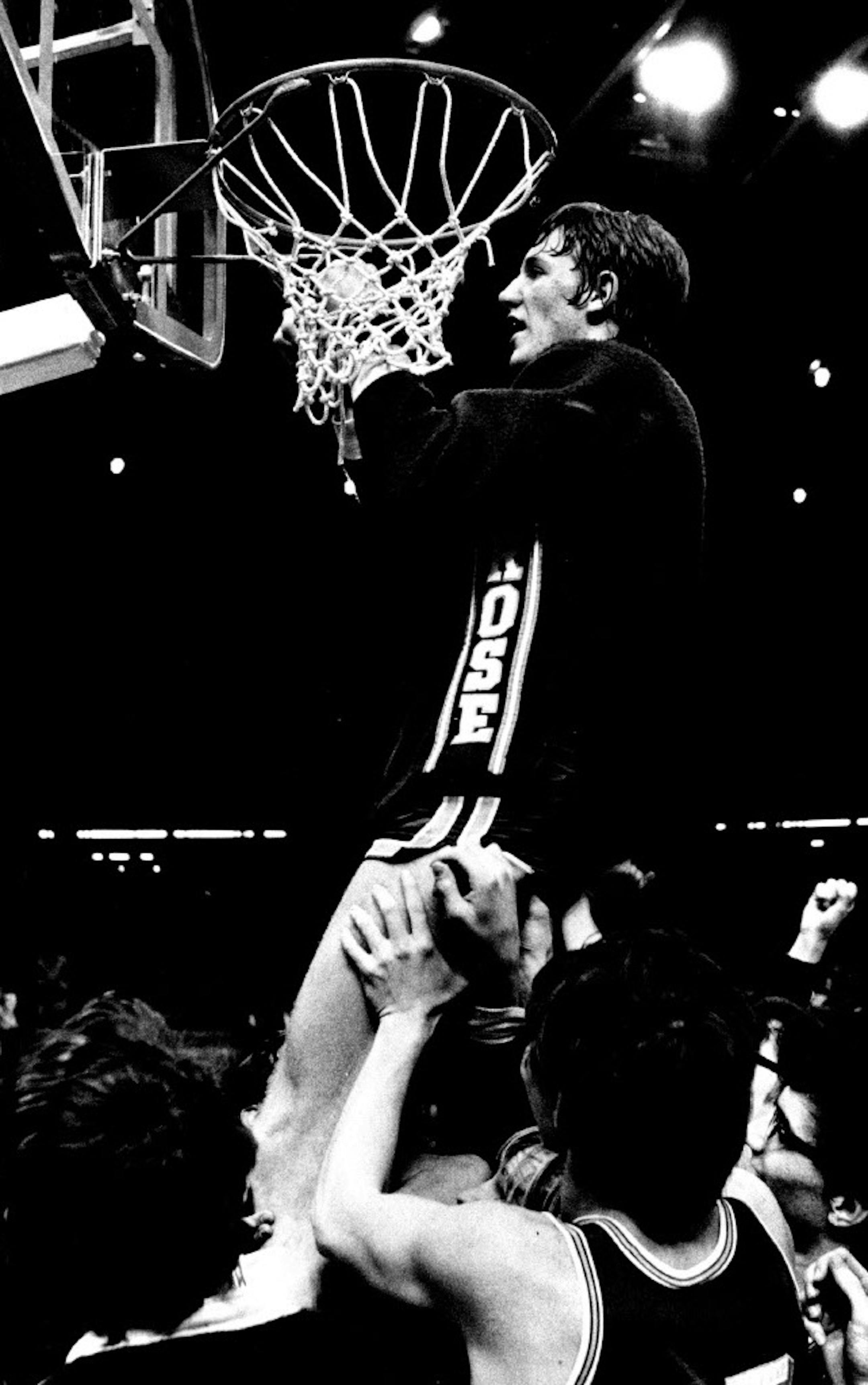 March 26, 1974 Melsore wins play-off Melsore center Mark Olberding cut down the net, a trophy of his team's 58-42 victory Monday over bemidji in the play-off game between Minnesota high school basketball class champion at the St. Paul Civic Center. The 6-foot-7 1/2 All-Stater scored 30 points as Melsore ended the season unbeaten. March 25, 1974 John Croft, Minneapolis Star Tribune