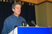 Sen. Norm Coleman speaks at a news conference in Moorhead, Minn. He said allegations in a lawsuit that a friend and donor funneled $75,000 to an insur