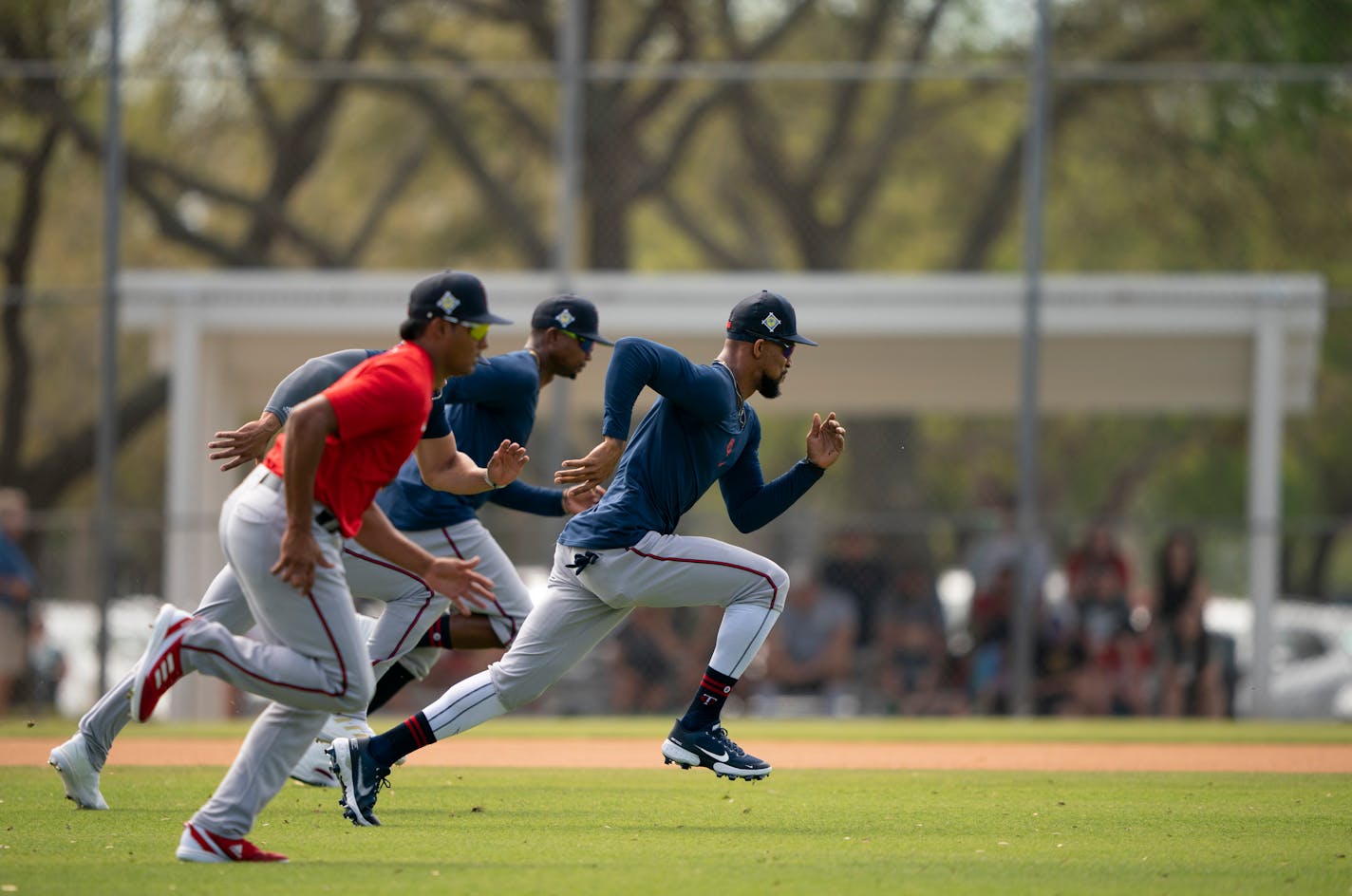 Outfielder Byron Buxton, right, took the lead in his group running interval sprints while warming up at Hammond Stadium in Fort Myers, Florida Monday, March 14, 2022. After some late night roster moves, the Twins full squad reported to Spring Training for Monday's workout. ] JEFF WHEELER • Jeff.Wheeler@startribune.com ORG XMIT: MIN2203141852240112