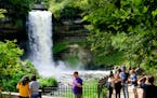 Visitors to Minnehaha Falls checked their selfies before leaving. ] GLEN STUBBE * gstubbe@startribune.com Friday, September 2, 2016 This year has shap