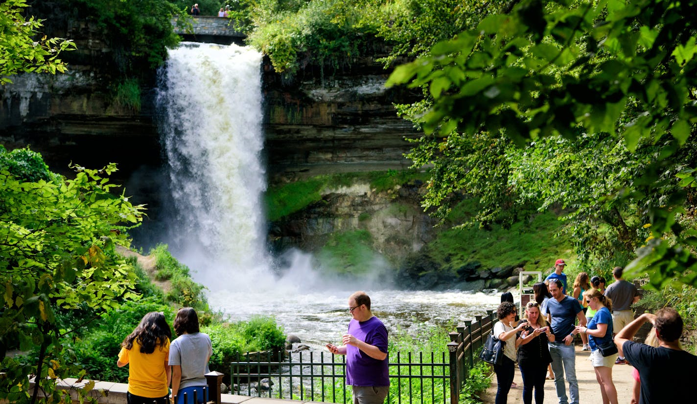 Visitors to Minnehaha Falls checked their selfies before leaving. ] GLEN STUBBE * gstubbe@startribune.com Friday, September 2, 2016 This year has shaped up to be the eighth wettest summer on record in the Twin Cities, prompting no-wake rules and high water warnings at metro lakes and rivers as boaters head out this Labor Day weekend for the final big boating weekend of the year. On Wednesday, the Minnehaha Creek Watershed District recommended no paddling on the creek because it's flowing too qui