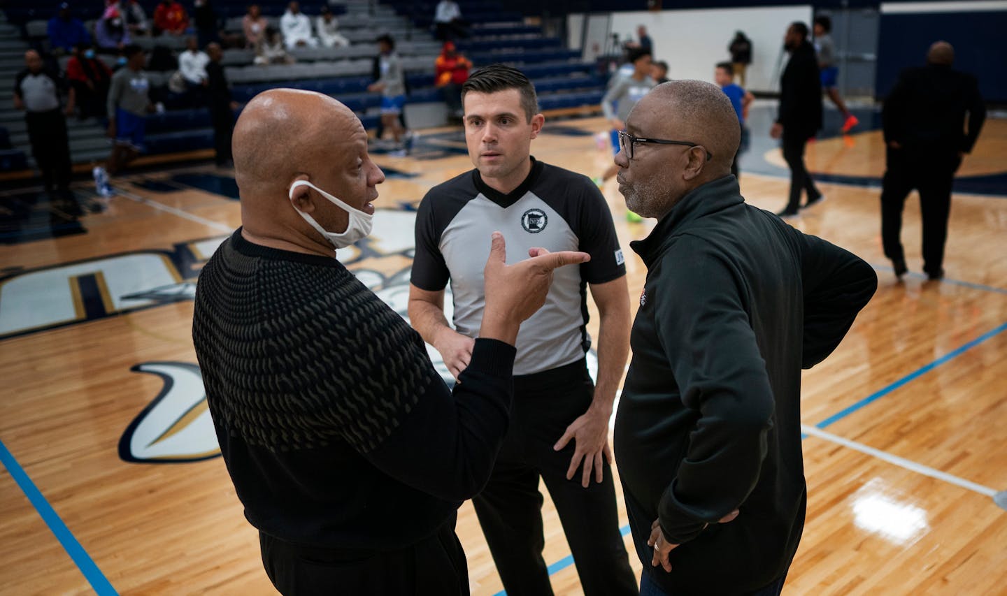 Head coach Greg Wise, left, of Jack Yates Houston talks with Minneapolis North coach Larry McKenzie , in Minneapolis, Minn., on Tuesday, Dec. 28, 2021. Minneapolis North boys' basketball will play Houston (Texas) Yates High School in a tournament played at North Central University called the George Floyd Memorial Holiday Classic. Houston Yates was the high school Floyd played for back in the day. ] JERRY HOLT •Jerry.Holt@startribune.com