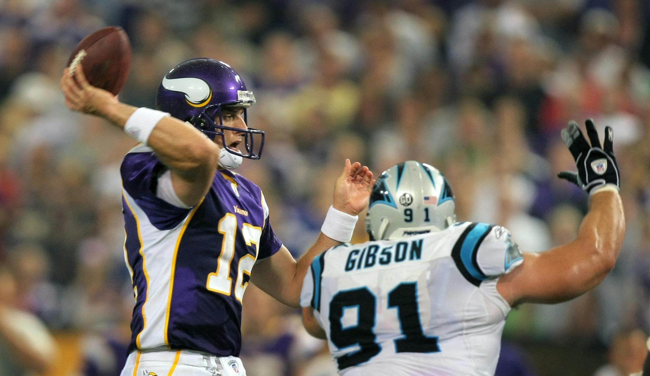 Vikings quarterback Gus Frerotte completes a pass while being pressured by Carolina's Gary Gibson in the third quarter.