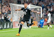 Minnesota United midfielder Kervin Arriaga (33) celebrates after scoring a goal against Toronto FC during the second half of an MLS soccer match Satur