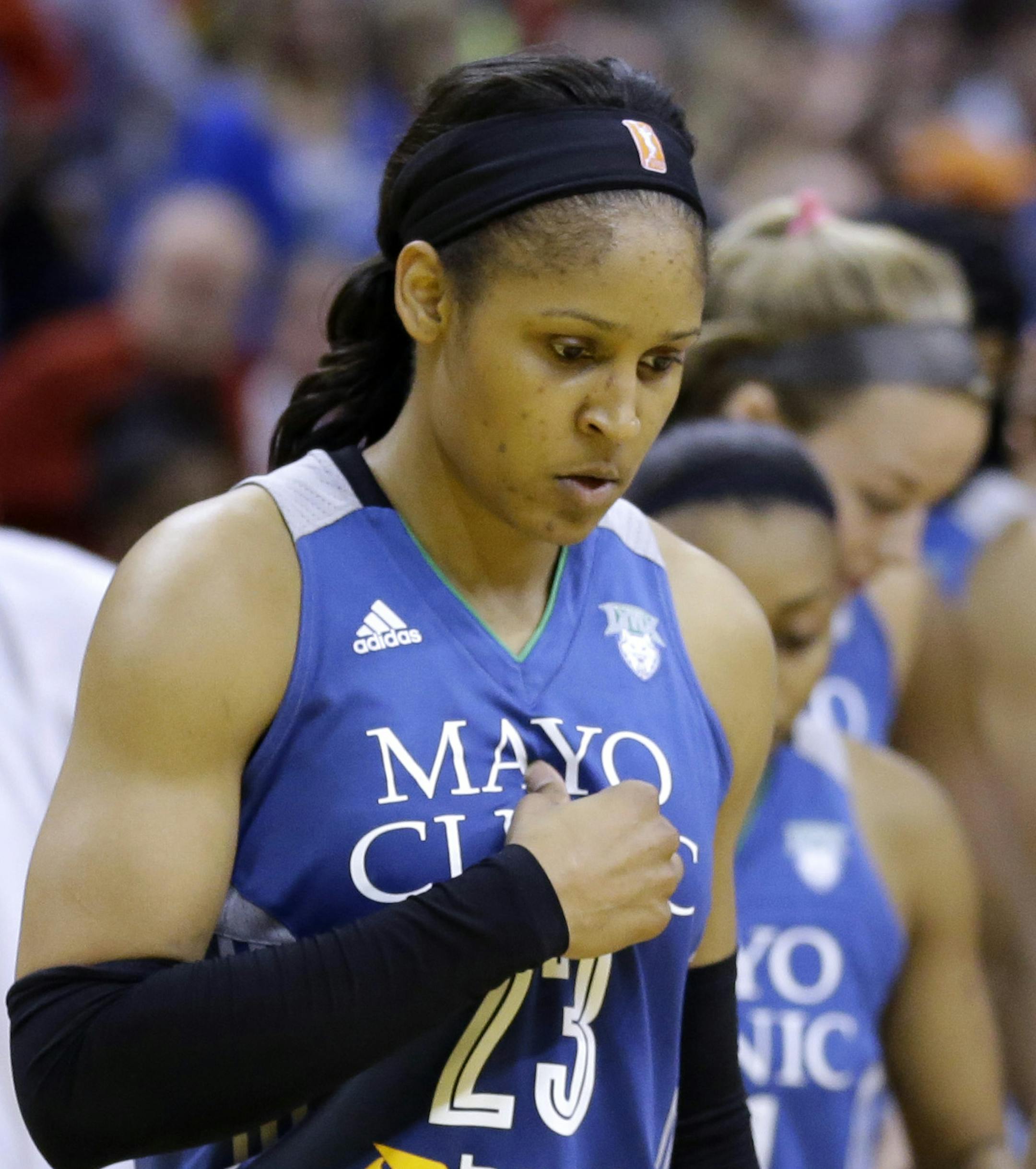 Minnesota Lynx's Maya Moore walks off the court after the Minnesota's 75-69 loss to the Indiana Fever in Game 4 of the WNBA Finals basketball series, in Indianapolis, Sunday, Oct. 11, 2015. The Fever defeated the Lynx tied the series and force Game 5 on Wednesday in Minneapolis. (AP Photo/Michael Conroy)