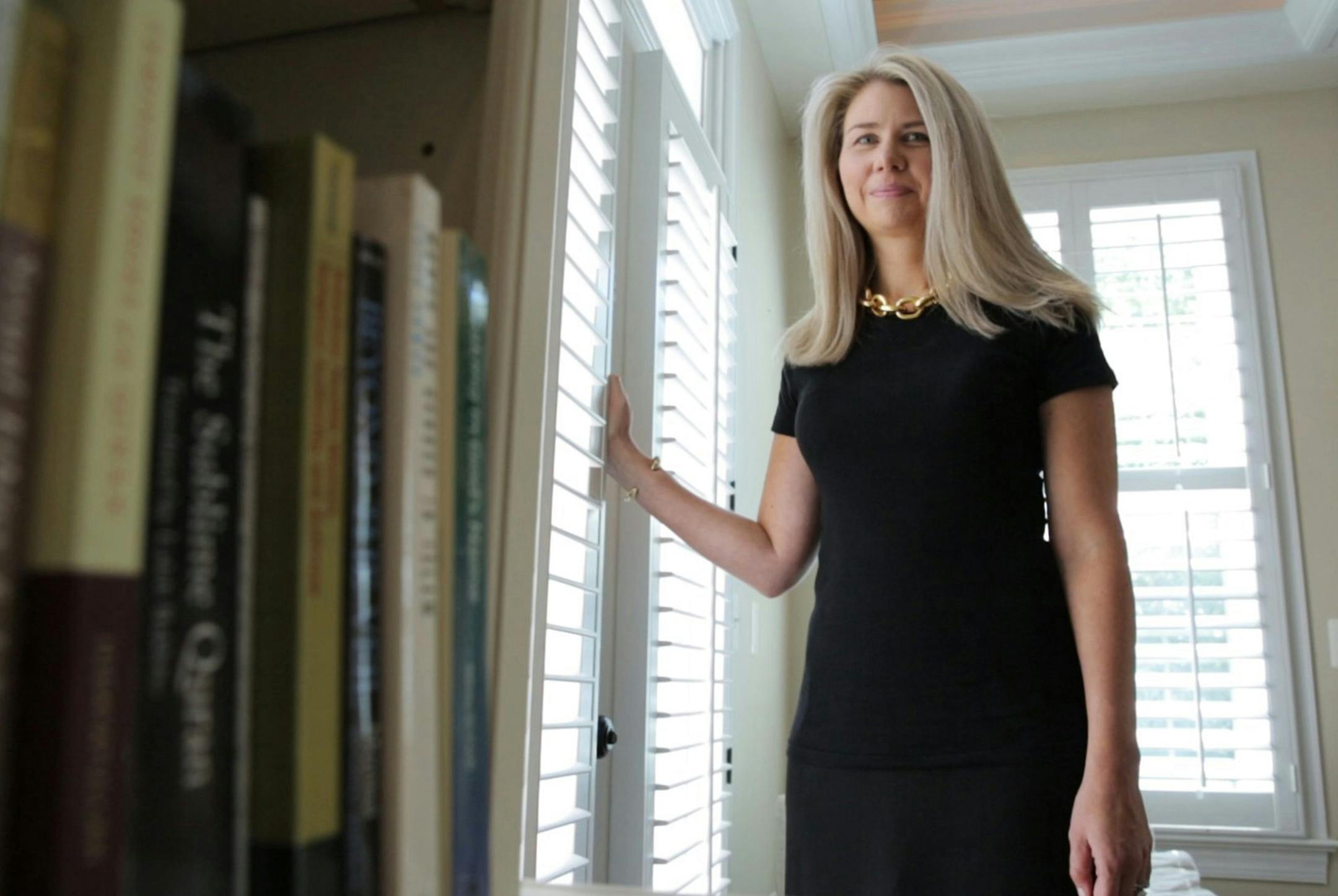 Jennifer Zobair, author of the novel "Painted Hands," poses for a portrait in her home last summer. The DC area author hopes that young Muslim women who might pick up the book can identify with her characters through their own personal exploration. (Jessica Koscielniak/McClatchy/TNS)