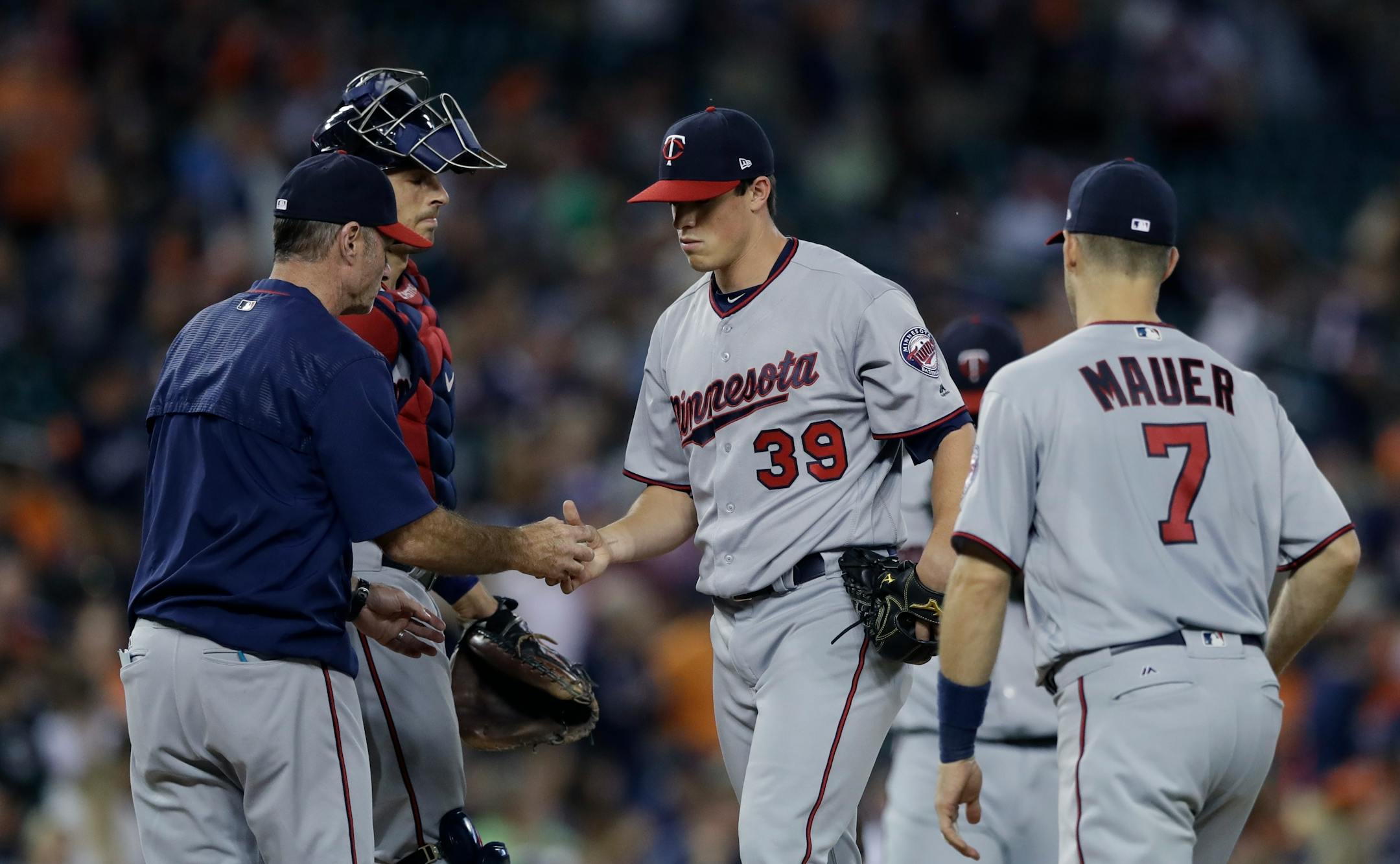 Minnesota Twins relief pitcher Trevor Hildenberger is relieved during the eighth inning of a baseball game against the Detroit Tigers, Saturday, Aug. 12, 2017, in Detroit. (AP Photo/Carlos Osorio)