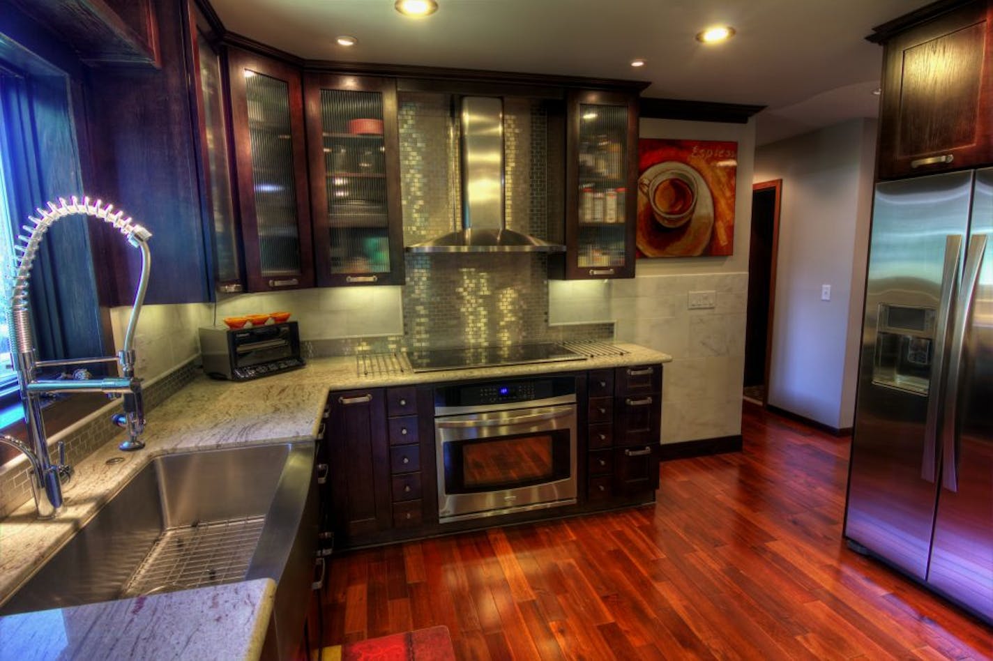 New flooring, cabinets, granite counters and stainless-steel subway tiles transformed the kitchen.