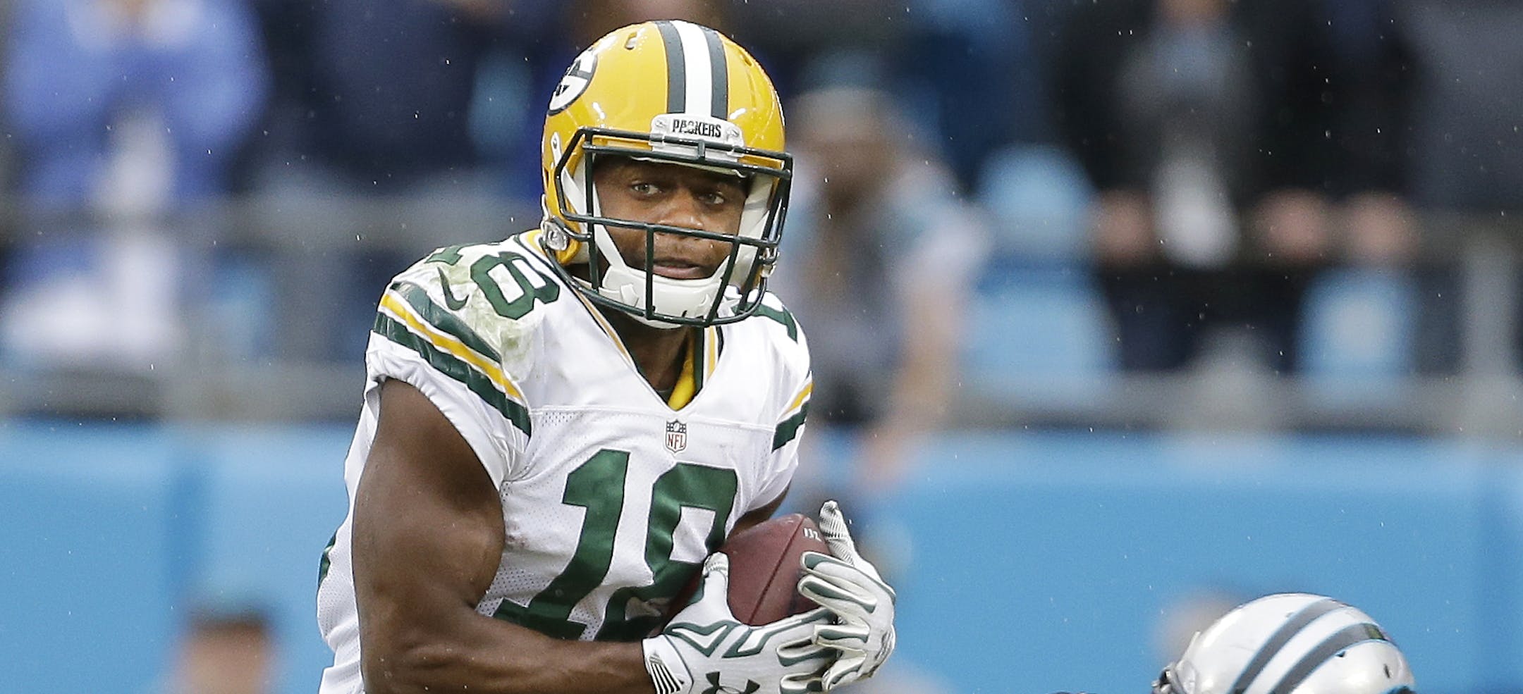 Green Bay Packers' Randall Cobb (18) makes the catch in front of Carolina Panthers' Bene' Benwikere (25) during the second half of an NFL football game in Charlotte, N.C., Sunday, Nov. 8, 2015. The Panthers won 37-29. (AP Photo/Bob Leverone)