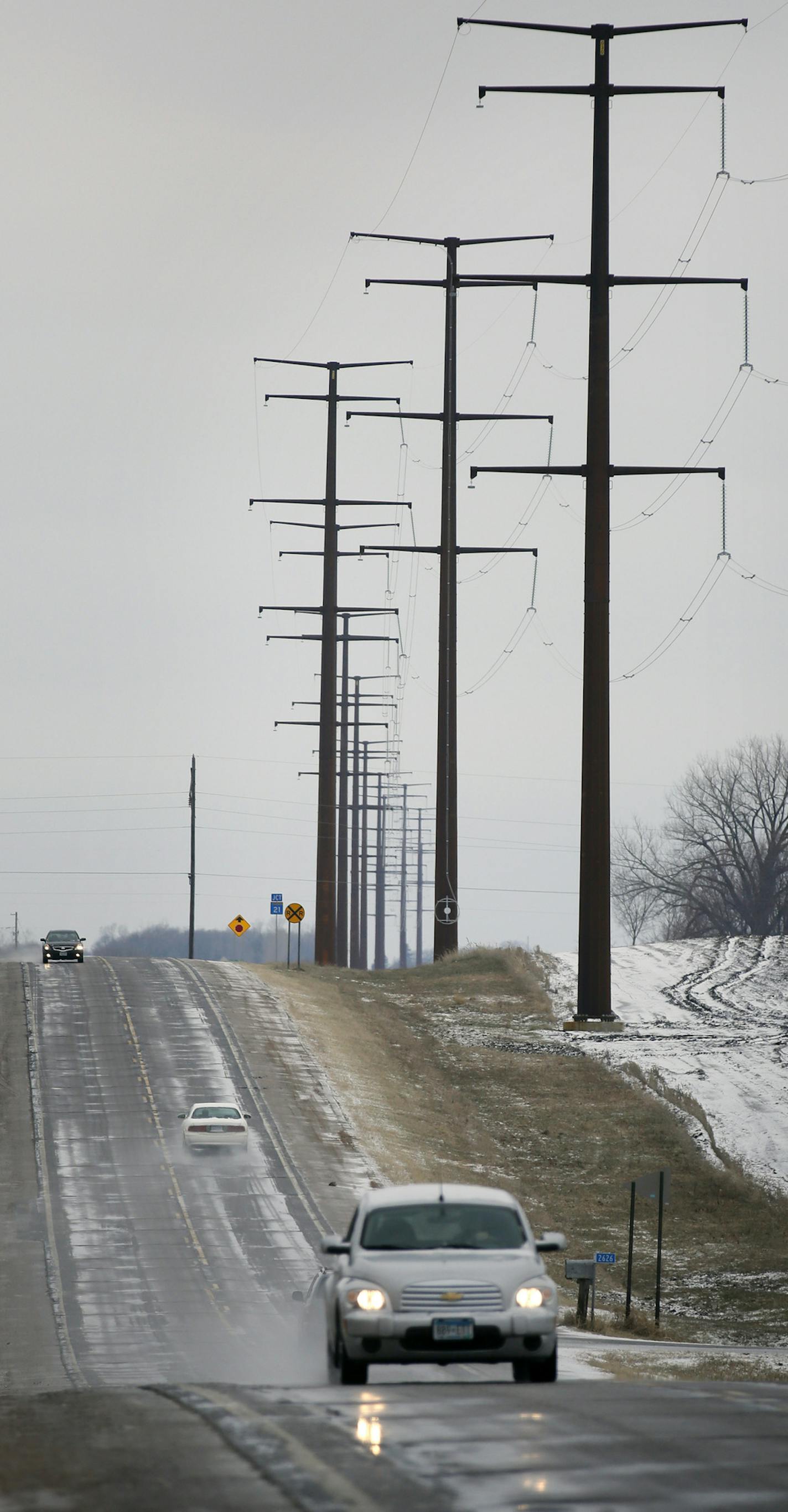 One year after he thought he triumphed with overwhelming bipartisan support in the Minnesota Legislature, Dave and Florence Minar, owners of one of the state's top organic farms, finds themselves in court next week, fighting still to exert their rights over the powerline company that has run its massive lines across their land. Here, Power Lines run along side the road near Cedar Summit Farm. ] BRIAN PETERSON &#x2022; brian.peterson@startribune.com New Prague, MN 4/17/2014