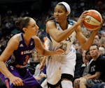 Minnesota Lynx forward Maya Moore (23) looks to pass against Phoenix Mercury guard Diana Taurasi (3) during Game 1 of the WNBA basketball playoffs Wes