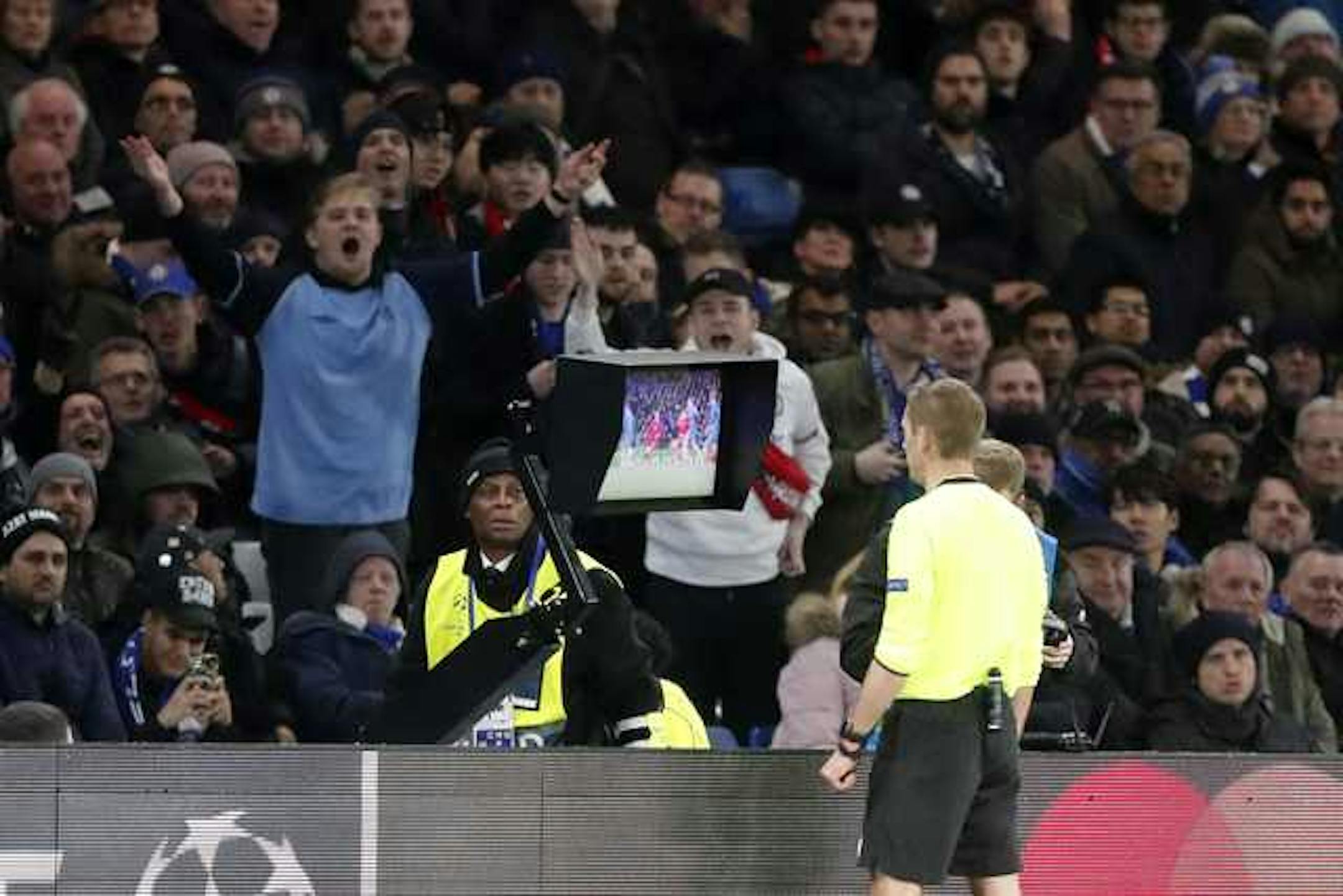 French referee Clement Turpin checks the VAR during the Champions League round of 16 soccer match between Chelsea and Bayern Munich on Feb. 20 at Stamford Bridge in London.