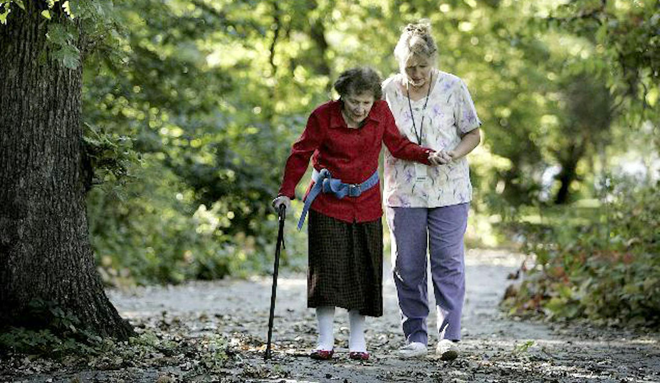 Trudy Nesvig got help during a walk from aide Andrea Brinkman outside Nesvig's home in Gaylord, Minn. Nesvig is recovering from a broken hip and gets help from Sibley Medical Center Home Care, a top-ranked home care agency in the state.