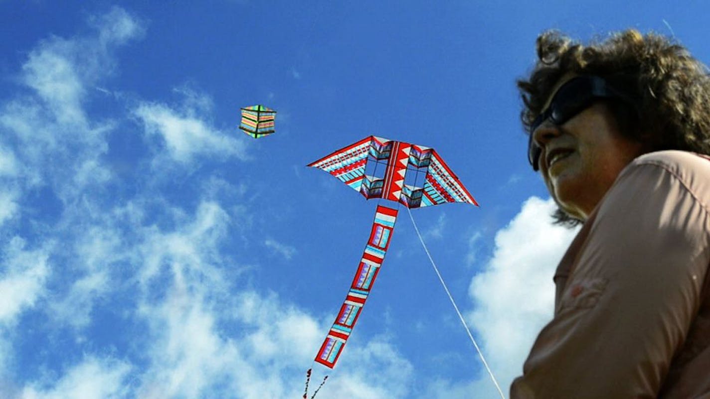 Barbara Meyer, president of the American Kite Fliers Association, flew her kites at the Valley View Middle School softball field in Bloomington.