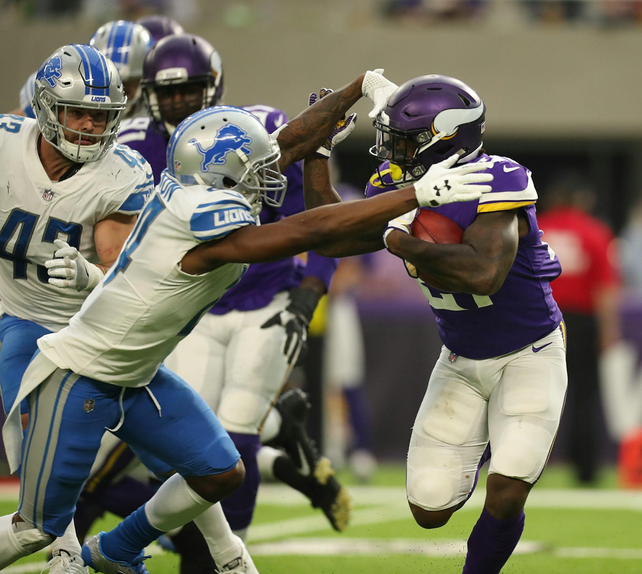Minnesota Vikings running back Jerick McKinnon returned a third quarter Lions kickoff 32 yards before he was stopped by Detroit Lions cornerback Nevin Lawson.