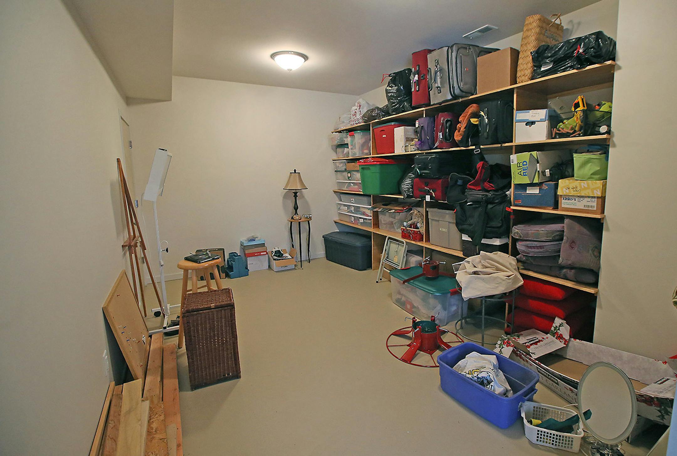 Under the porch is a new storage room with built-in shelving.