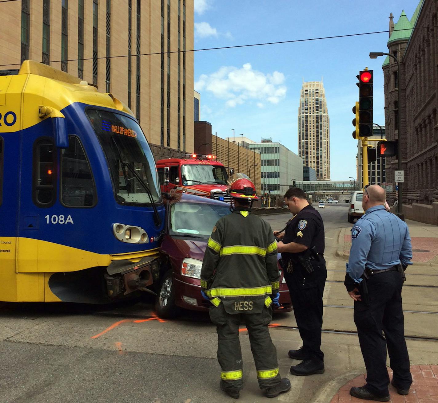 A light rail train struck a car Sunday afternoon, April 12, 2015, in downtown Minneapolis, leaving the tracks blocked. The collision occurred about 12:45 p.m. The car's driver, a man, did not appear to be seriously hurt. (Claude Peck, Star Tribune)