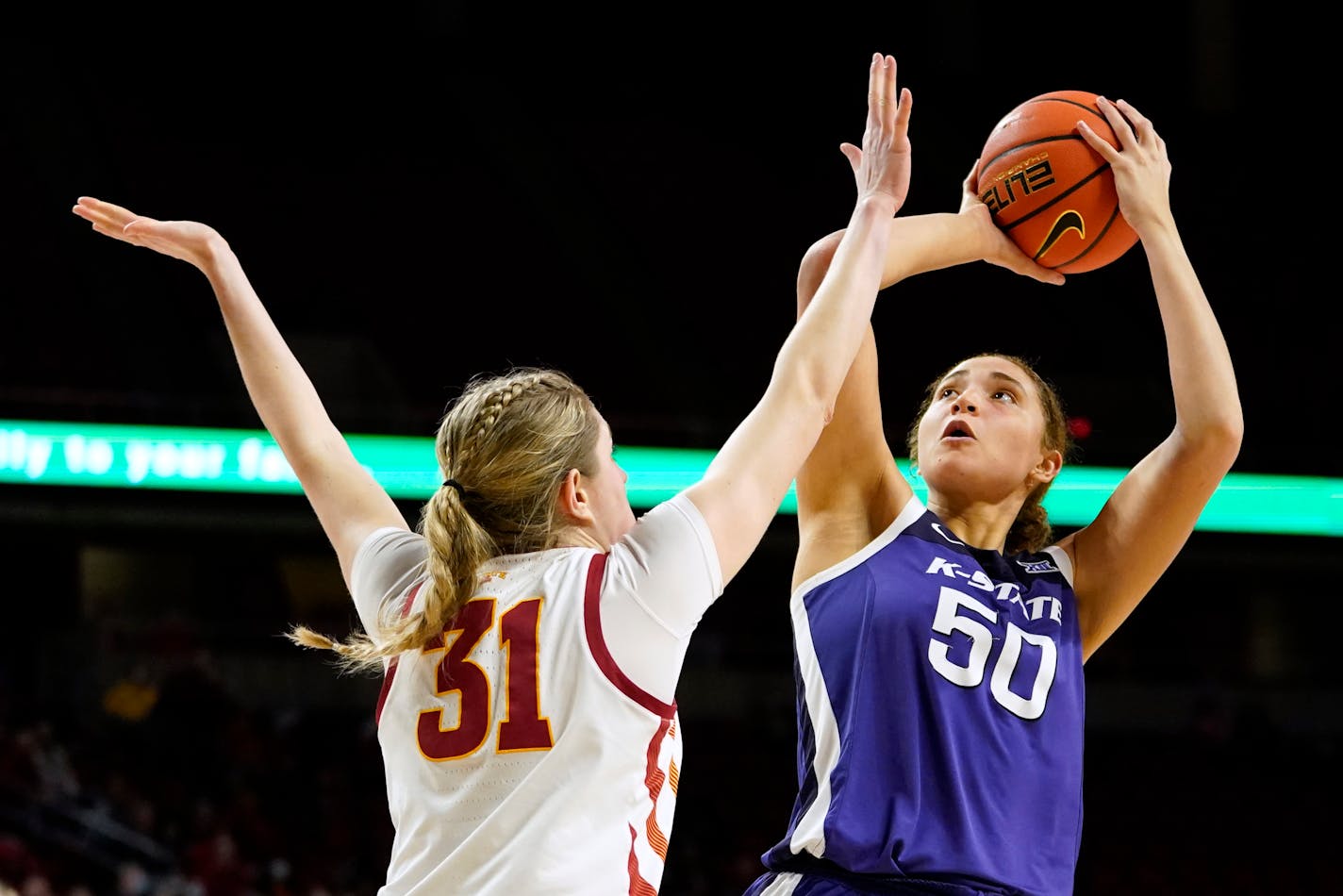 Kansas State center Ayoka Lee (50) shoots over Iowa State forward Morgan Kane (31) during the second half of an NCAA college basketball game, Wednesday, Feb. 2, 2022, in Ames, Iowa. Iowa State won 70-55. (AP Photo/Charlie Neibergall) ORG XMIT: IACN112