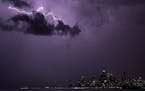 Lightning strikes above downtown Chicago as a storm moves over Lake Michigan on Feb. 27, 2024.