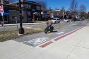 A bicyclist uses the Bryant Avenue bike lane in Minneapolis on Thursday, April 4.