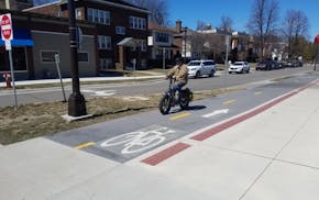 A bicyclist uses the Bryant Avenue bike lane in Minneapolis on Thursday, April 4.