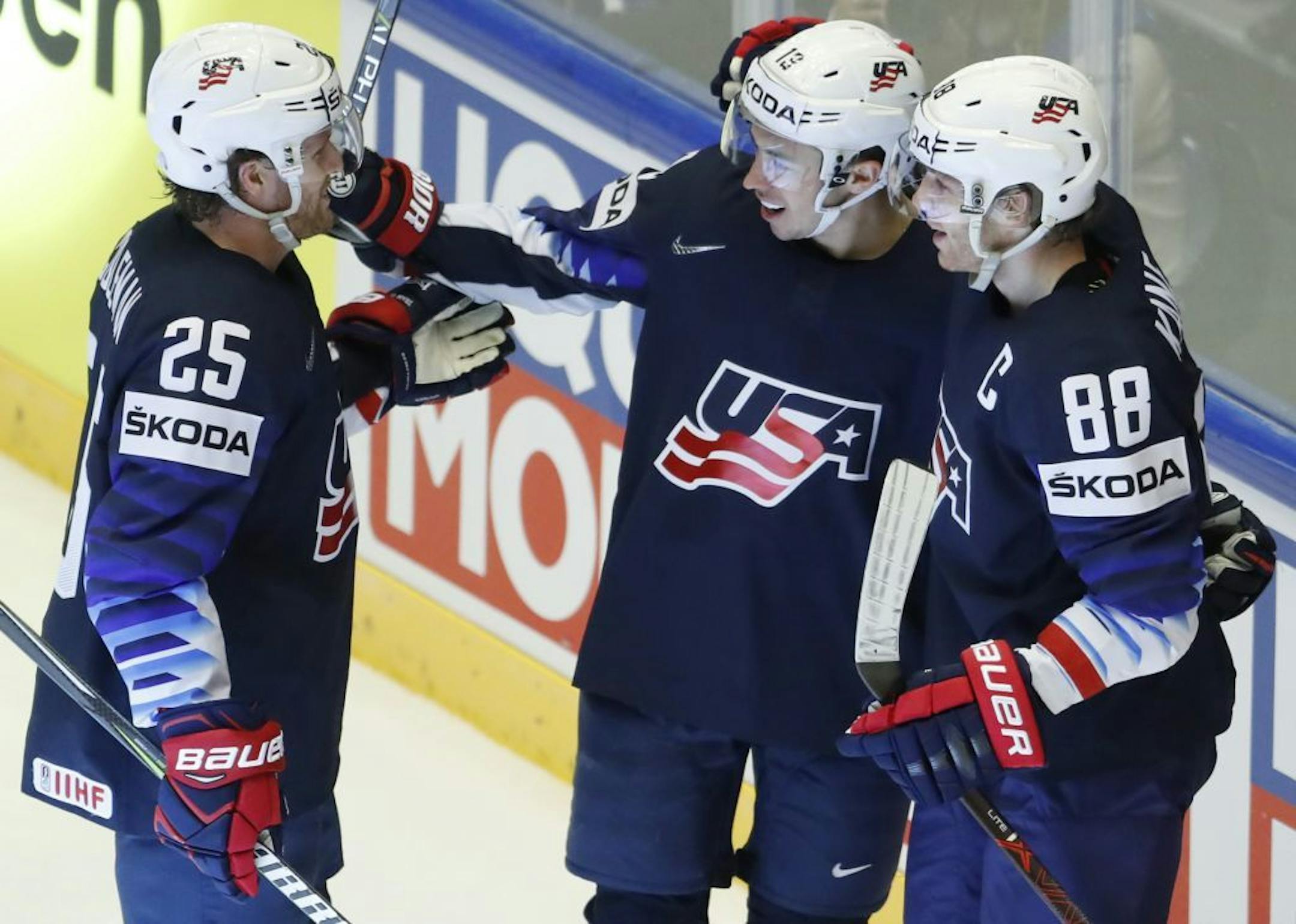 Johnny Gaudreau, center, of the United States celebrates with teammates Patrick Kane, right, and Blake Coleman, left, after scoring a goal during the Ice Hockey World Championships group B match between United States and Canada at the Jyske bank Boxen arena in Herning, Denmark, Friday, May 4, 2018.