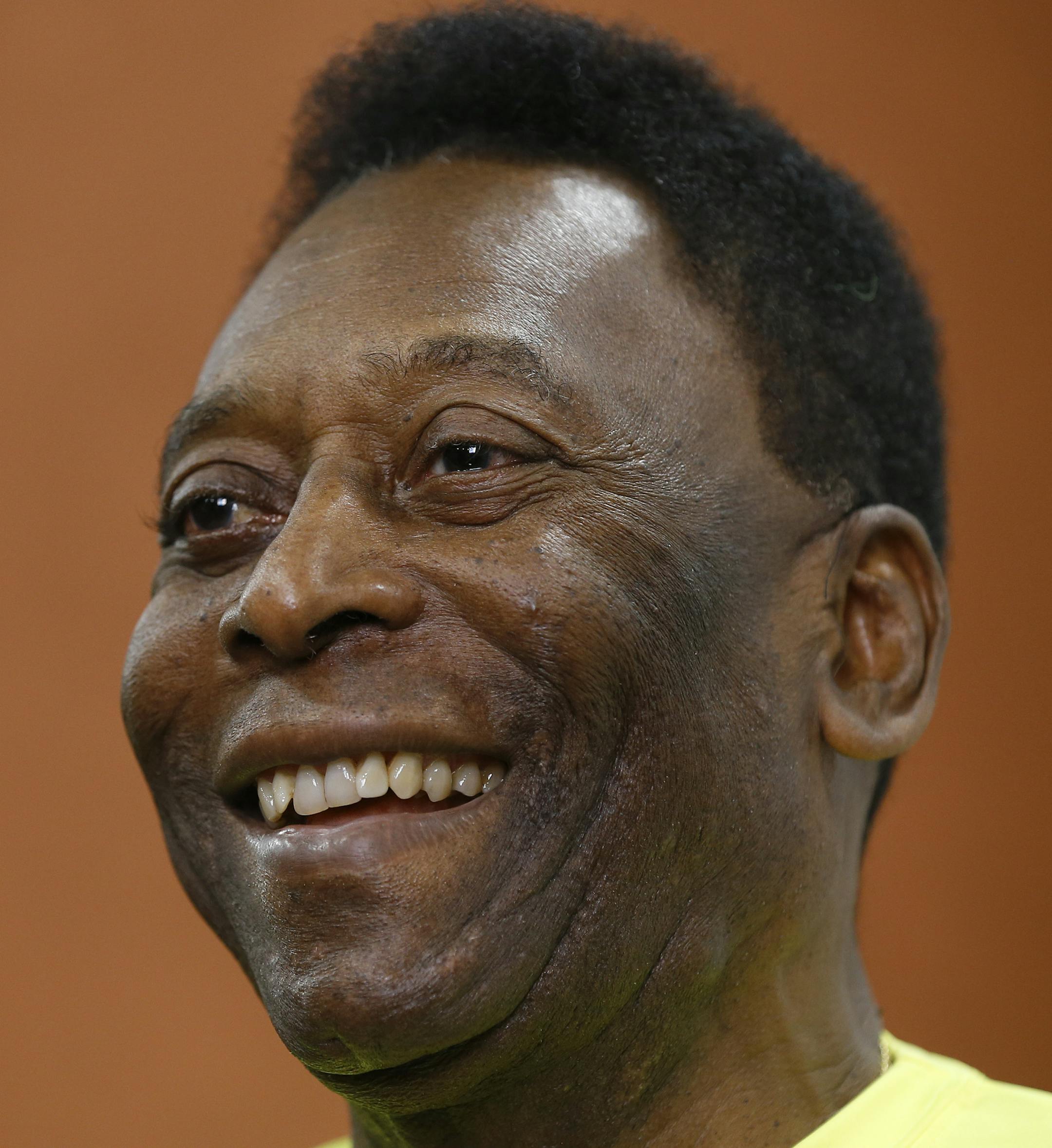 FILE - In this March 20, 2015, file photo, Brazilian soccer legend Pele smiles during a media opportunity at a restaurant in London. A Brazilian hospital says Pele is hospitalized in Sao Paulo. Mirtes Bogea, a press officer for the Albert Einstein hospital, said Saturday, July 18, 2015 she could only confirm Pele's hospitalization. She said she was not allowed to say when he was hospitalized or why. (AP Photo/Kirsty Wigglesworth,File)