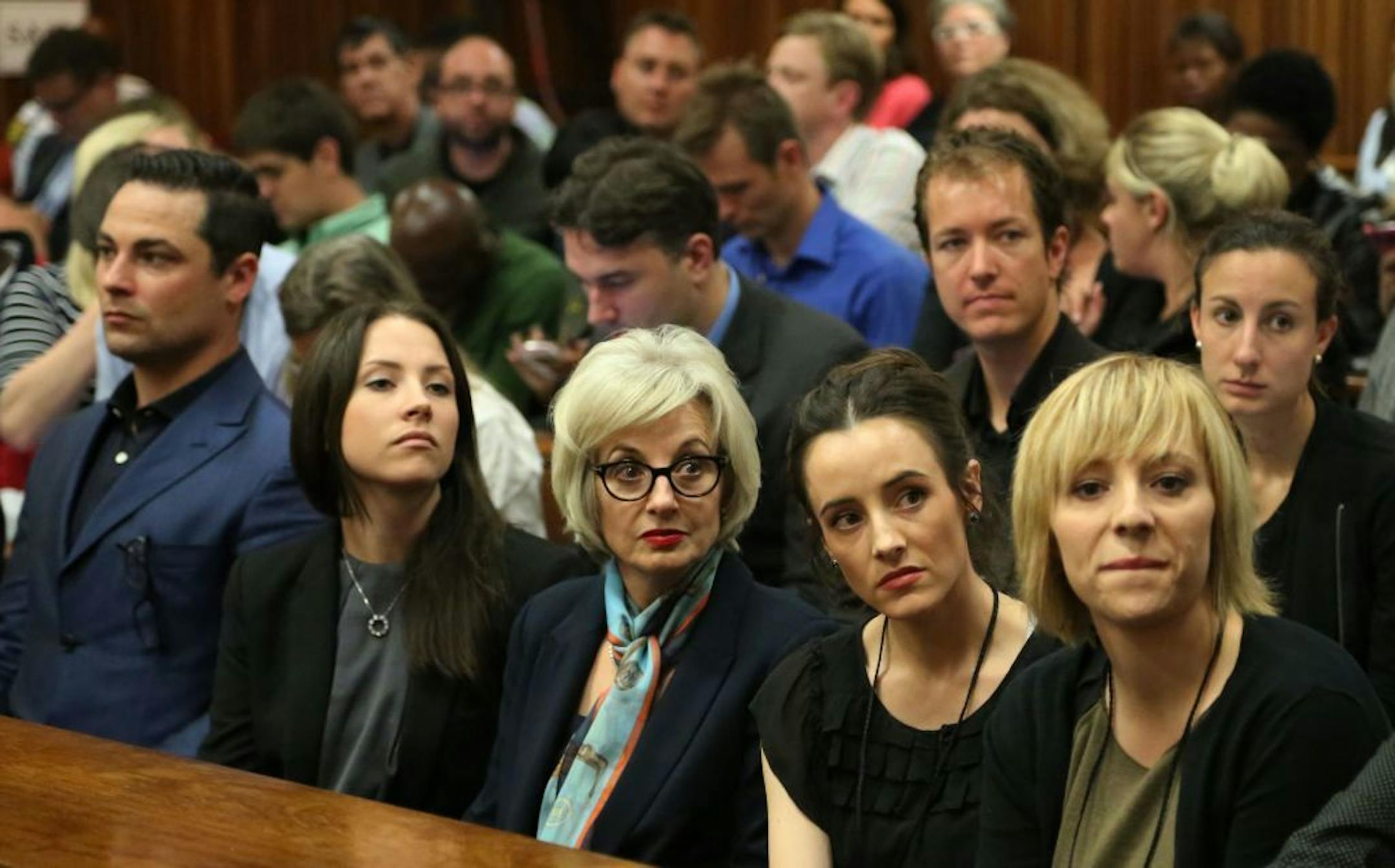 Relatives of Oscar Pistorius wait inside the high court prior to the start of his trial in Pretoria, South Africa, Monday, March 3, 2014.