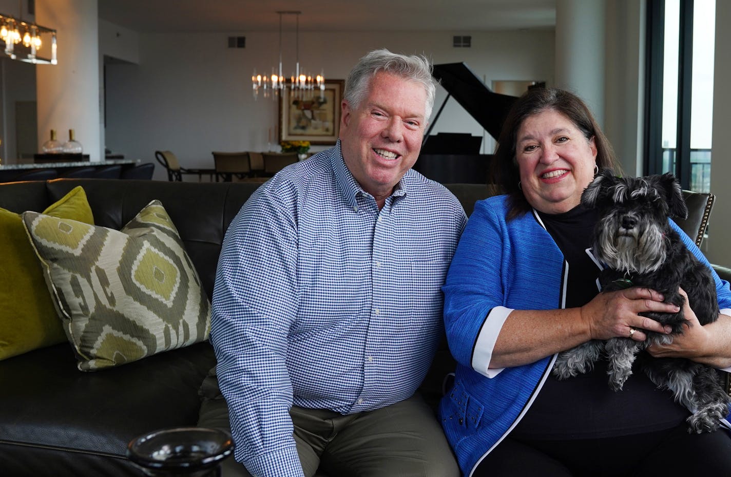 Gail and Randy Ross, with their dog, Charlotte, still love living downtown.